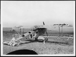 A badly damaged German biplane. Photo by J.W. Brooke. Made available by National Library Scotland under a CC BY-SA-NC licence.